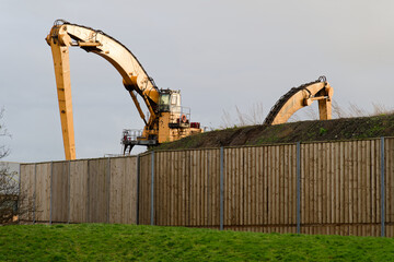 Wall Mural - Construction site digger yellow during excavation on building site