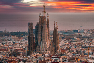 Fototapete - Beautiful aerial view of the Barcelona city with a Sagrada Familia cathedral standing in the city center.