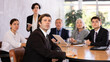 © JackF - Focused businessman sitting at table in office, listening attentively to presentation of partners during meeting