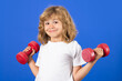 © Olena - Child boy working out with dumbbells. Kids sport and active healthy life. Sport and kids training.