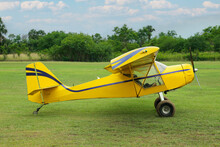 View Of Beautiful Ultralight Airplane In Field On Autumn Day