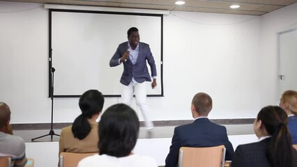 Sticker - Portrait of cheerful successful man giving motivation training at conference hall