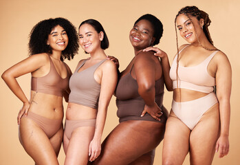 Wall Mural - Diversity, happy woman and body portrait of group together for inclusion, skin beauty and power. Underwear model friends on beige background for positivity, pride and motivation support for self love
