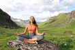 © Antonioguillem - Yogi doing yoga exercise in a mountain valley