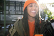 © Westend61 - Cheerful woman wearing knit hat on sunny day