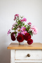 Bouquet Of Red And Pink Autumn Flowers On Night Table