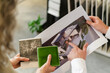 © Westend61 - Two colleagues holding printout of a house and tile samples in architect's office