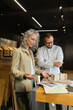 © Westend61 - Two colleagues working on project in architect's office together