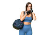 © luismolinero - Young sport woman with sport bag over isolated chroma key background is suffering with cough and feeling bad