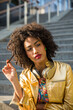 © oneinchpunch - Beautiful afro-american girl with afro hairstyle and stylish clothing