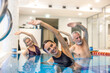 © zinkevych - Senior adults in the swimming pool during aqua aerobics class