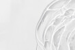 © Marina Kaiser - Transparent serum or gel with hyaluronic acid for the face on a white background. Textured background with oxygen bubbles. Wellness and beauty concept.
