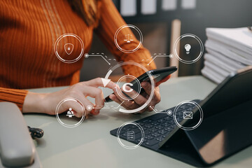 Wall Mural - Copyright or patent concept, Person hand using laptop computer, tablet and smartphone with virtual screen copyright icon trademark, Creation ownership against piracy. at office..