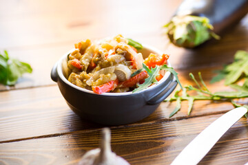 Wall Mural - eggplant fried sauteed with other vegetables in a plate