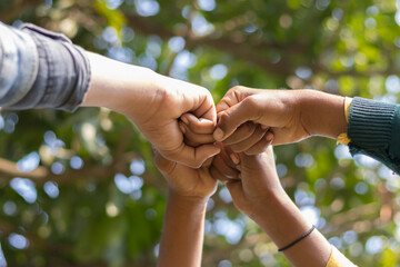 Group of teenager volunteer join hand together concept, Volunteer charity work People joining for cooperation success.sustainable development goal, World environment day with global community teamwork