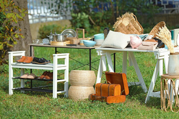 Wall Mural - Small tables with many different items on garage sale in yard