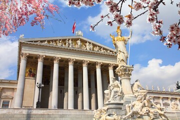 Poster - Austrian Parliament building in Vienna. Spring time cherry blossoms.