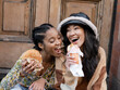 Two young women eating fast food