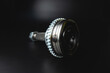 © yanik88 - SHRUS brand new with copy space on black background. Shallow depth of field new metal detail. Background of new spare parts in selective focus