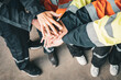 © Success Media - Closeup of teamwork holding hands and supporting each other