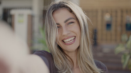 Sticker - Young blonde woman smiling confident making selfie by camera at street