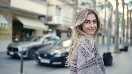 Sticker - Young blonde woman smiling confident standing at street