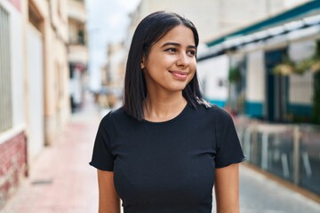 Poster - Young latin woman smiling confident standing at street