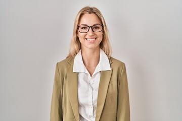 Sticker - Young caucasian woman wearing glasses looking positive and happy standing and smiling with a confident smile showing teeth