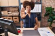 © Krakenimages.com - African american woman ecommerce business worker doing stop gesture with hand at office