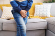 © Krakenimages.com - Adorable hispanic boy covering his genitals with hands at home