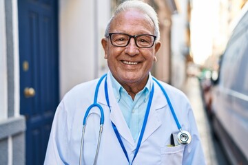 Wall Mural - Senior man wearing doctor uniform standing at street