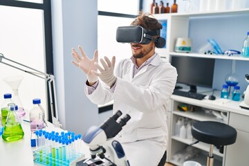 Sticker - Young arab man scientist using virtual reality glasses working at laboratory