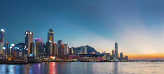 Wall Mural - Panorama of Victoria harbor of Hong Kong city under sunset