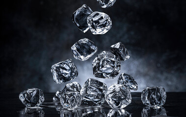 Wall Mural - falling ice cubes on black background