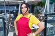 © Krakenimages.com - Young beautiful arab woman waitress smiling confident standing at coffee shop terrace