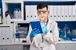 © Krakenimages.com - Young non binary man scientist write on touchpad at laboratory