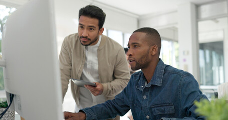 Businessman, startup and coaching conversation at desk with tablet, computer and question for mentor in office. Black man, web design coach and learning in workplace for support, advice or teamwork