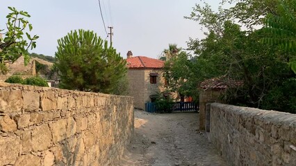 Wall Mural - Footage of narrow street, traditional, old historical houses in famous, touristic Aegean town called 