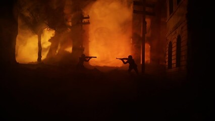 Wall Mural - Army sniper with large caliber rifle standing in the fire and smoke. War Concept. Battle scene on war fog sky background, Fighting silhouettes Below Cloudy Skyline at night. City destroyed by war