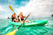 © Mirko Vitali - Happy retired couple enjoying travel moment paddling on kayak at Angthong marine park in Ko Samui in Thailand - Active elderly concept around world nature wonders - Bright vivid filtered tone