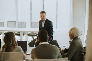 Sticker - Young businessman presenting results to his coleagues in the office