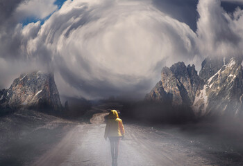 Fantastic landscape. Person in a yellow jacket  walking in the mountains .