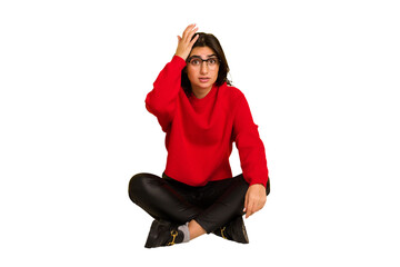 Wall Mural - Young indian woman sitting on the floor cut out isolated being shocked, she has remembered important meeting.