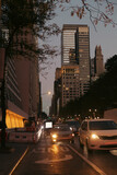 Fototapeta  - Buildings and road traffic at evening on Manhattan in New York City.