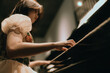 © Pansfun Images/Stocksy - young woman playing piano