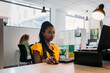 © VICTOR TORRES/Stocksy - Pensive black woman at office table with laptop and mouse