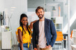 © VICTOR TORRES/Stocksy - Happy african american woman with her boss at the office