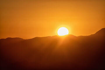 Wall Mural - The sunset is graded in the sky, with breathtaking blue to orange reds.