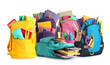 Set with different backpacks and school stationery on white background