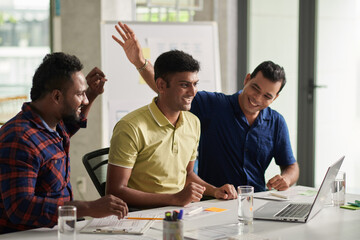 Wall Mural - joyful team of developers and ux designers having online meeting with investors